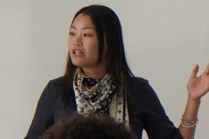 A Photo of Associate Professor Sherry Yu teaching a class.